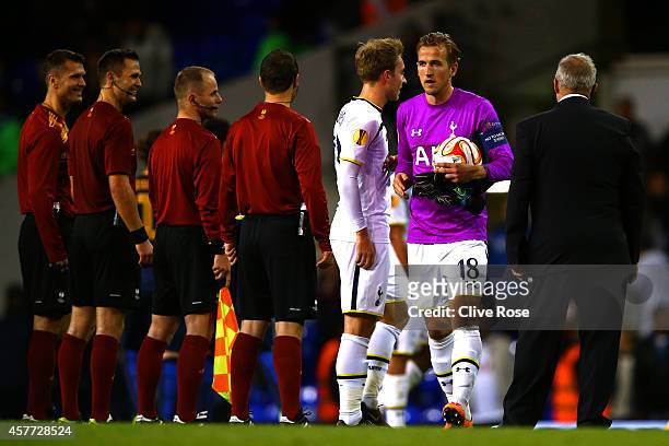 Harry Kane of Spurs, wearing the goalkeeper's shirt of team-mate Hugo Lloris, holds the match ball following his hat-trick during the UEFA Europa...