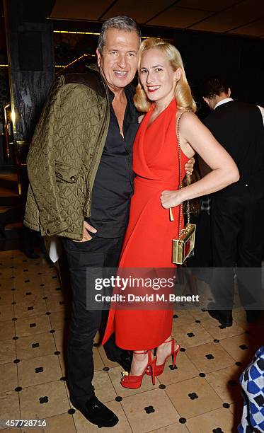 Mario Testino and Charlotte Olympia Dellal attend the Charlotte Olympia 'Handbags for the Leading Lady' launch dinner at Toto's Restaurant on October...