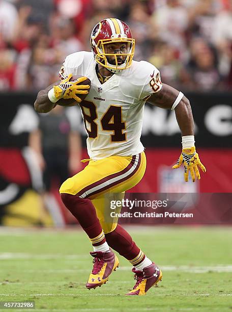 Tight end Niles Paul of the Washington Redskins runs with the football against the Arizona Cardinals during the NFL game at the University of Phoenix...