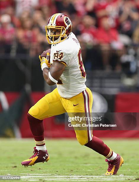 Tight end Niles Paul of the Washington Redskins runs with the football against the Arizona Cardinals during the NFL game at the University of Phoenix...