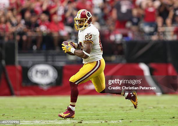 Tight end Niles Paul of the Washington Redskins runs with the football against the Arizona Cardinals during the NFL game at the University of Phoenix...