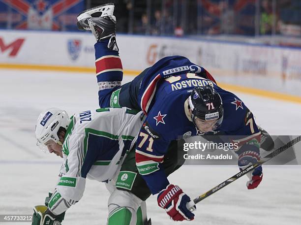 Anton Burdasov of SKA St. Petersburg and Andrei Zubarev of Salavat Yulaev Ufa in action during the Kontinental Ice Hockey League match between SKA...