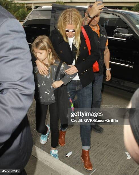 Gwyneth Paltrow and Apple Martin are seen at LAX airport on December 18, 2013 in Los Angeles, California.