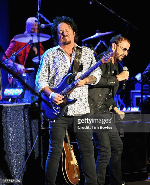 Steve Lukather and Ringo Starr of Ringo Starr & His All-Starr Band perform at Ruth Eckerd Hall on October 23, 2014 in Clearwater, Florida.