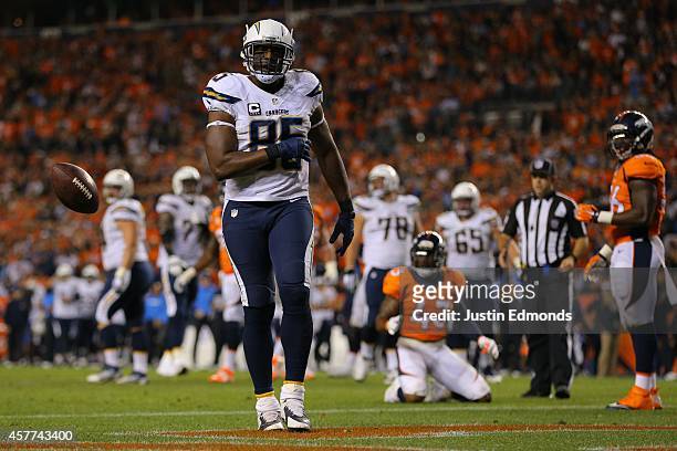 Tight end Antonio Gates of the San Diego Chargers tosses the ball after a 4 yard touchdown reception in the third quarter of a game against the...