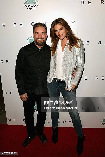 Model Cindy Crawford and photographer Brian Bowen Smith attend the Brian Bowen Smith WILDLIFE show hosted by Casamigos Tequila at De Re Gallery on...