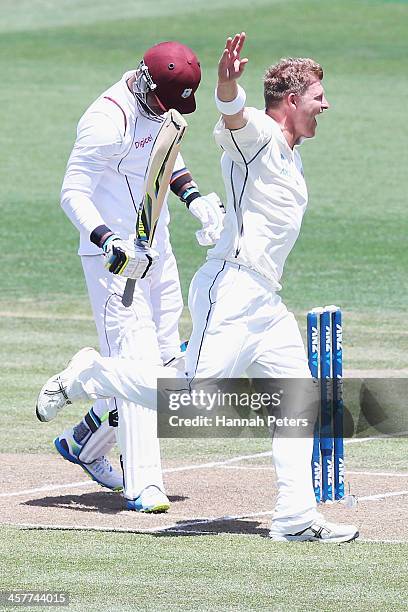 Corey Anderson of New Zealand celebrates the wicket of Marlon Samuels of the West Indies during day one of the Third Test match between New Zealand...