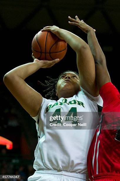 Kristina Higgins of the Baylor Bears drives to the basket against Danielle McCray of the Mississippi Lady Rebels on December 18, 2013 at the Ferrell...