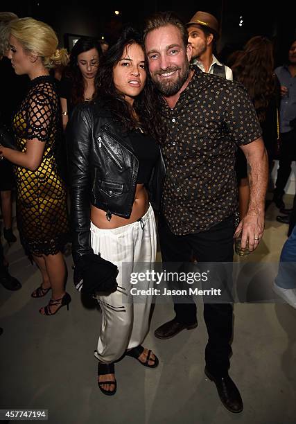 Actress Michelle Rodriguez and photographer Brian Bowen Smith attend the Brian Bowen Smith WILDLIFE show hosted by Casamigos Tequila at De Re Gallery...