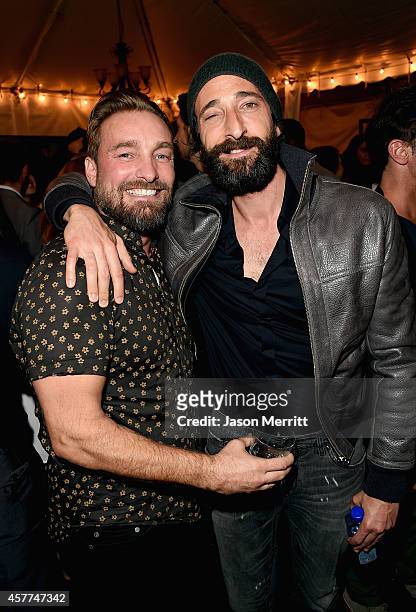 Actor Adrien Brody poses with photographer Brian Bowen Smith at the Brian Bowen Smith WILDLIFE show hosted by Casamigos Tequila at De Re Gallery on...