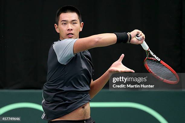 Chieh-Fu Wang of Chinese Taipaei in action against Michael Venus of New Zealand in his match during day one of the Davis Cup tie between New Zealand...