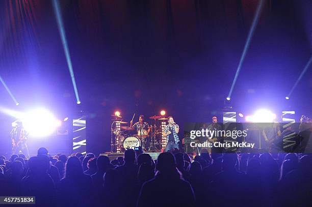 James Young, Chris Thompson, Mike Eli, and Jon Jones of The Eli Young Band perform at Arena at Gwinnett Center on October 23, 2014 in Duluth, Georgia.