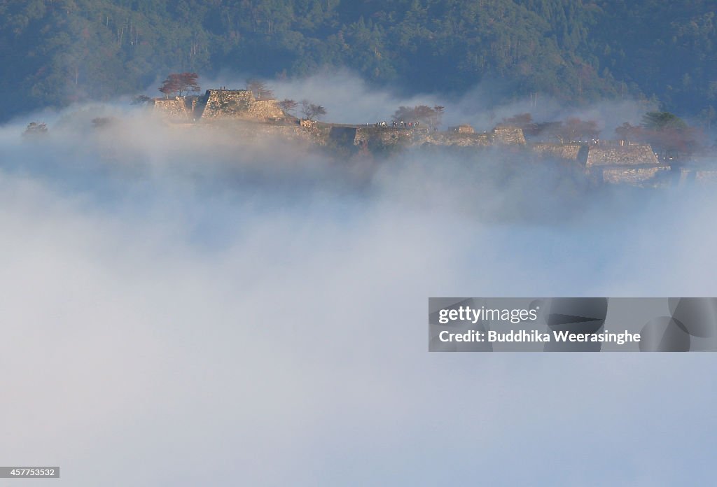 Historical Mountain Castle Covered by Autumn Fog
