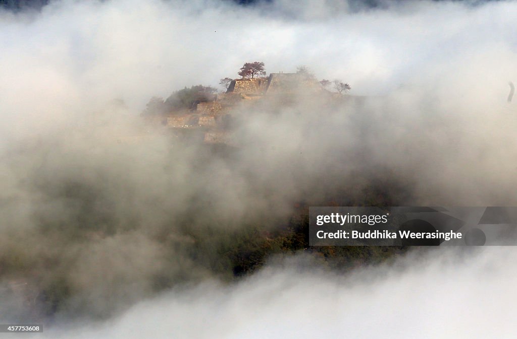 Historical Mountain Castle Covered by Autumn Fog