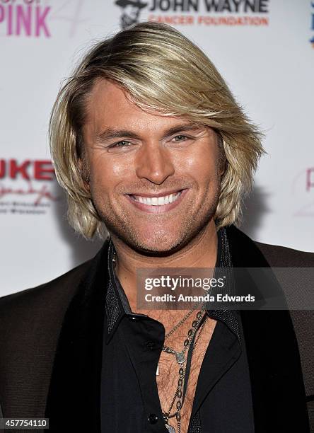 Singer Marcus Collins of the Texas Tenors arrives at the 2014 Power Of Pink: An Acoustic Evening With P!nk And Friends event at The House of Blues...