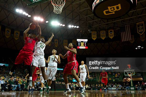 Tia Faleru of the Mississippi Lady Rebels has her shot blocked by Sune Agbuke the Baylor Bears on December 18, 2013 at the Ferrell Center in Waco,...