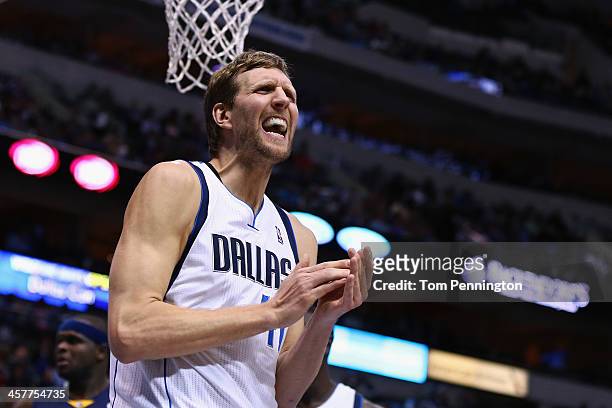 Dirk Nowitzki of the Dallas Mavericks reacts against the Memphis Grizzlies at American Airlines Center on December 18, 2013 in Dallas, Texas. NOTE TO...