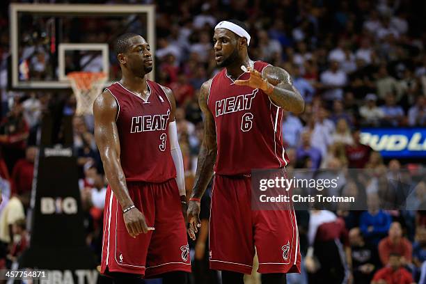 Dwyane Wade and LeBron James of the Miami Heat on court against the Indiana Pacers at American Airlines Arena on December 18, 2013 in Miami, Florida....