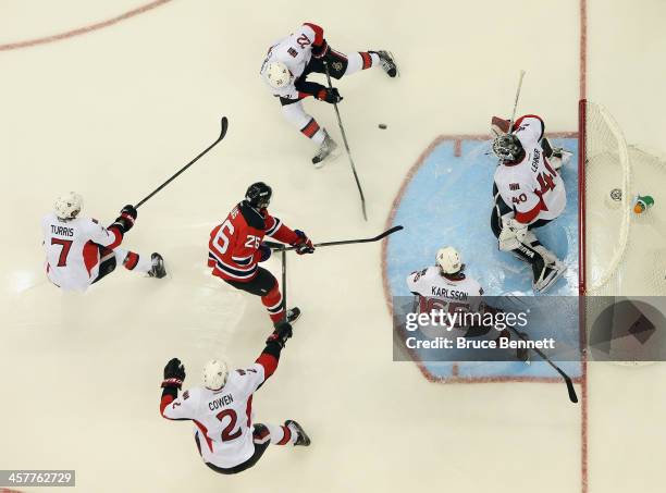 Patrik Elias of the New Jersey Devils skates in against the Ottawa Senators at the Prudential Center on December 18, 2013 in Newark, New Jersey. The...