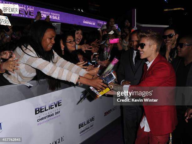 Singer/producer Justin Bieber arrives at the premiere Of Open Road Films' "Justin Bieber's Believe" at Regal Cinemas L.A. Live on December 18, 2013...