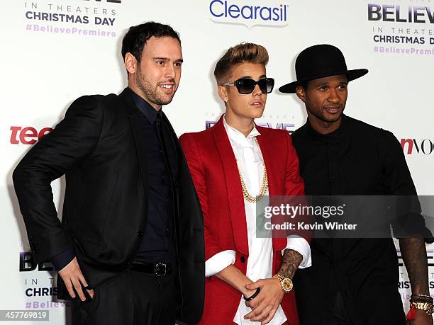 Producer Scooter Braun, singer/producer Justin Bieber and producer Usher arrive at the premiere Of Open Road Films' "Justin Bieber's Believe" at...