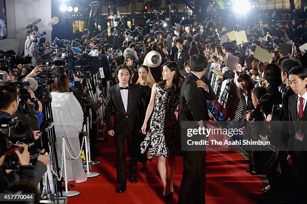 Guests walk on the red carpet during the opening ceremony of the 27th Tokyo International Film Festival at Roppongi Hills on October 23, 2014 in...