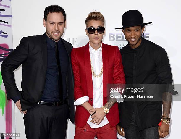 Producer Scooter Braun, singer/producer Justin Bieber and producer Usher arrive at the premiere of Open Road Films' "Justin Bieber's Believe" at...