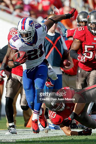 Cornerback Leodis McKelvin of the Buffalo Bills is force out of bounds by Running back Brian Leonard of the Tampa Bay Buccaneers during the game at...