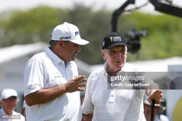 Angel Cabrera of Argentina talks to Roberto De Vicenzo during the first round of America's Golf Cup as part of PGA Latinoamerica tour at Olivos Golf...