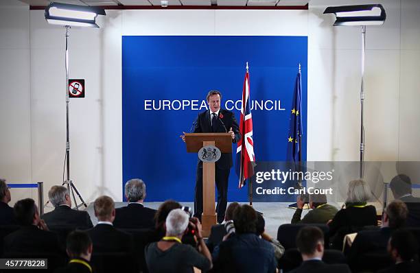 British Prime Minister David Cameron speaks during a press conference at the end of a two-day European Council meeting at the headquarters of the...