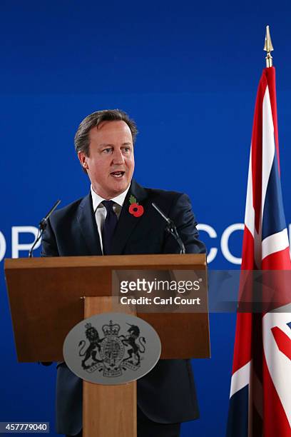 British Prime Minister David Cameron speaks during a press conference at the end of a two-day European Council meeting at the headquarters of the...