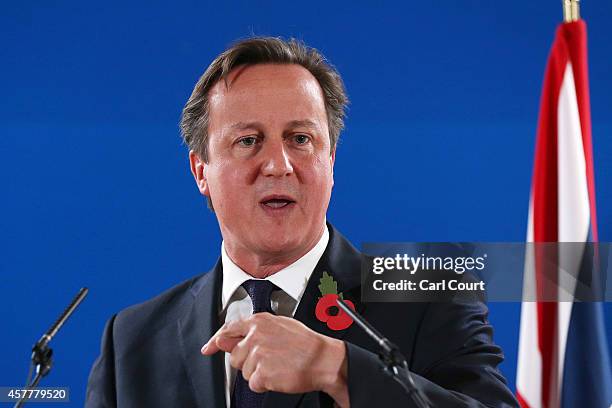 British Prime Minister David Cameron speaks during a press conference at the end of a two-day European Council meeting at the headquarters of the...