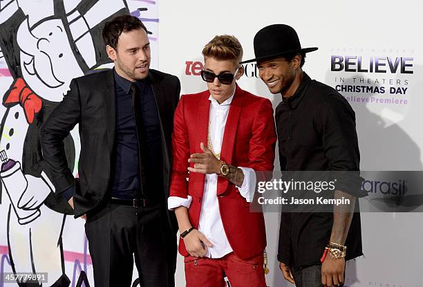 Producer Scooter Braun, singer/producer Justin Bieber and producer Usher attend the premiere of Open Road Films' "Justin Bieber's Believe" at Regal...