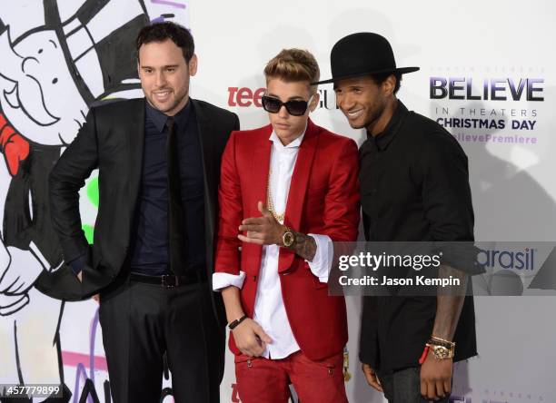 Producer Scooter Braun, singer/producer Justin Bieber and producer Usher attend the premiere of Open Road Films' "Justin Bieber's Believe" at Regal...