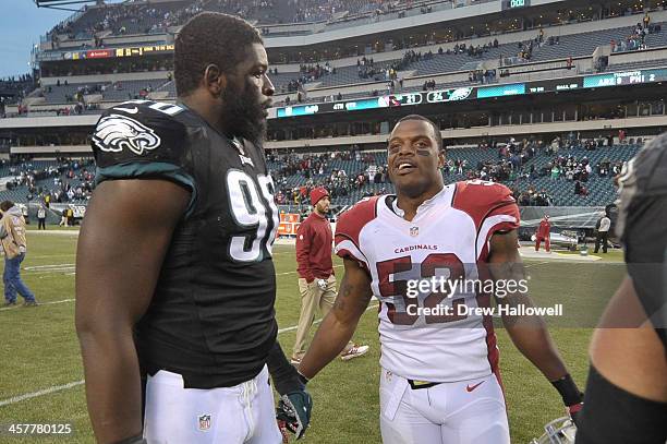 Clifton Geathers of the Philadelphia Eagles and Jasper Brinkley of the Arizona Cardinals talks after the game at Lincoln Financial Field on December...
