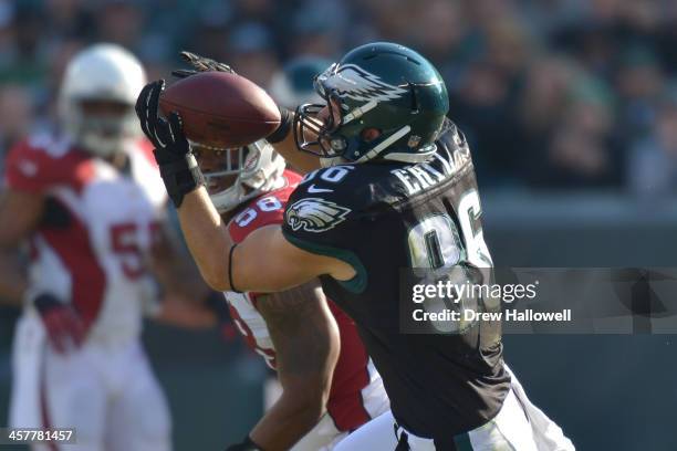 Zach Ertz of the Philadelphia Eagles catches as Daryl Washington of the Arizona Cardinals looks on at Lincoln Financial Field on December 1, 2013 in...