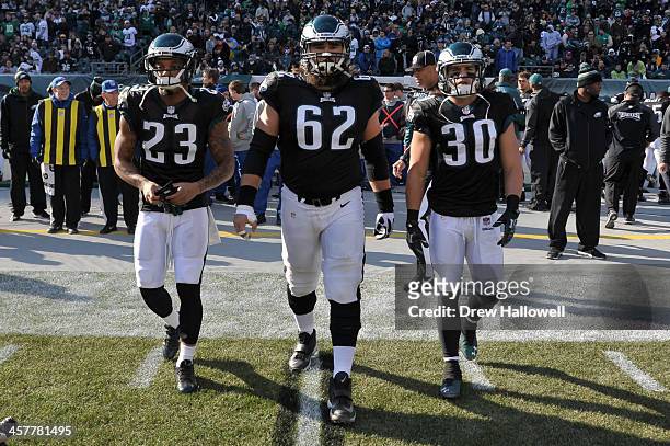Patrick Chung, Jason Kelce and Colt Anderson of the Philadelphia Eagles walk out for the coin toss before to game against the Arizona Cardinals at...