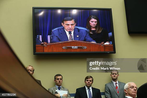 Chairman Darrell Issa is shown on a monitor speaking during a House Oversight and Government Reform Committee hearing on Capitol Hill, October 24,...