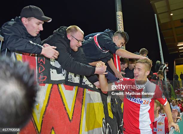 Maximilian Thiel of 1 FC Union Berlin celebrates the win with the Fans during the game between 1 FC Union Berlin against VfR Aalen on october 24,...