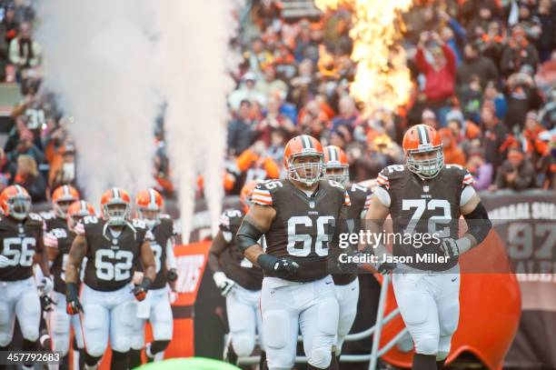 Guard Shawn Lauvao and tackle Mitchell Schwartz of the Cleveland Browns run out onto the field during the team introduction prior to the game against...