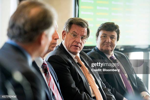 Rocky Wirtz, chairman of the Chicago Blackhawk Hockey Team Inc., center, speaks during a panel discussion with John McDonough, president and chief...