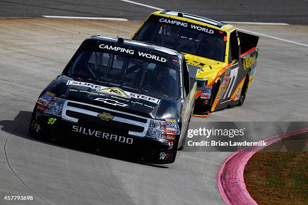 Dustin Hapka, driver of the Sure-Step Chevrolet, leads German Quiroga, driver of the Otterbox Toyota, during practice for the NASCAR Camping World...