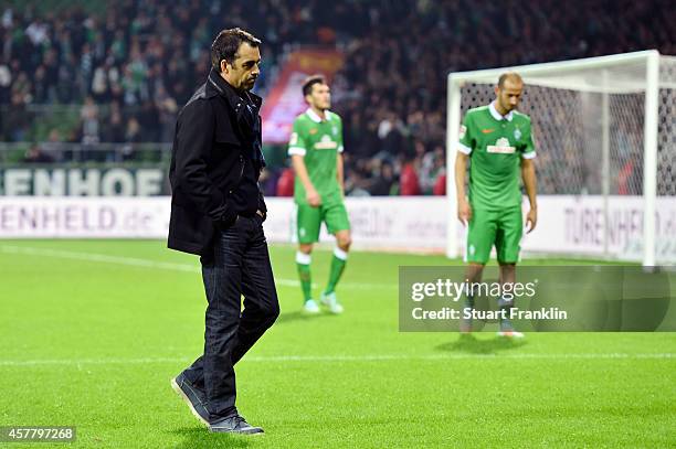 Dejected Robin Dutt the manager of Werder Bremen walks off the pitch following his team's 1-0 defeat during the Bundesliga match between SV Werder...