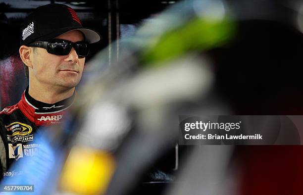 Jeff Gordon, driver of the Drive To End Hunger Chevrolet, looks on in the garage area during qualifying for the NASCAR Sprint Cup Series Goody's...
