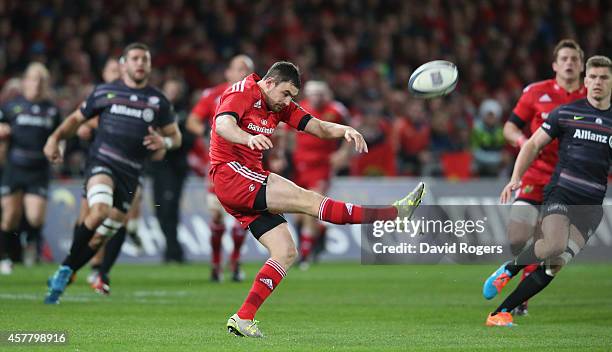 Felix Jones of Munster kicks the ball upfield during the European Rugby Champions Cup match between Munster and Saracens at Thomond Park on October...