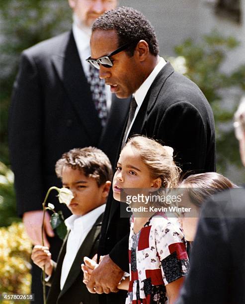 Actor, football star O.J. Simpson with his children Justin Simpson and Sydney Simpson at the funeral of their mother, Nicole Brown Simpson on June...