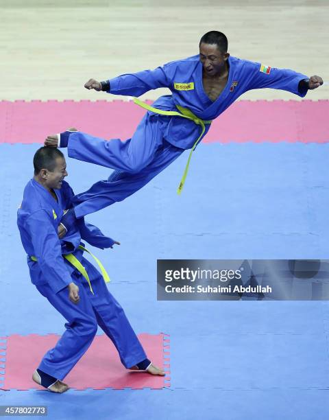 Team Myanmar competes in the Vovinam, Don Chan Tan Cong category during the 2013 Southeast Asian Games at Zayar Thiri Indoor Stadium A on December...