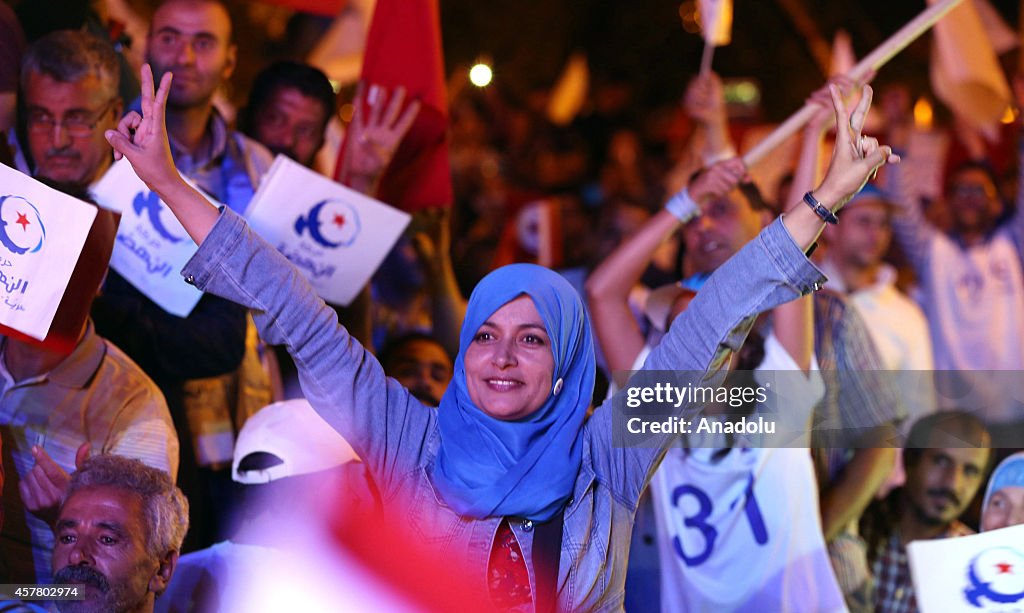 Rashid al-Ghannushi holds a rally ahead of Tunisian parliamentary election