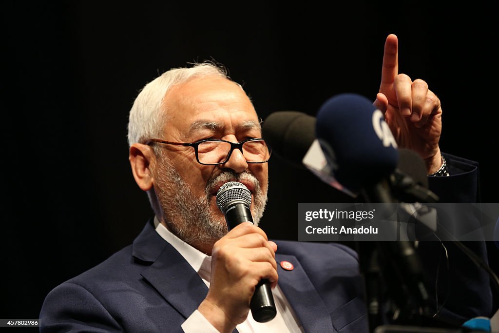 Rashid al-Ghannushi holds a rally ahead of Tunisian parliamentary election