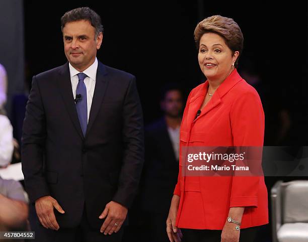 Brazilian President and Workers' Party candidate Dilma Rousseff stands with Presidential candidate of the Brazilian Social Democratic Party Aecio...